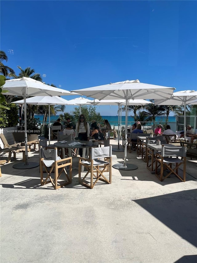 2301 Collins Ave Unit 326, Miami Beach, FL 33139 - view of patio / terrace with outdoor dining area and a water view