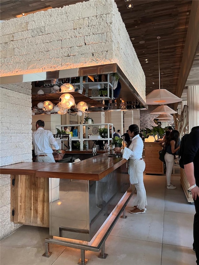 2301 Collins Ave Unit 326, Miami Beach, FL 33139 - bar with finished concrete floors and wood ceiling
