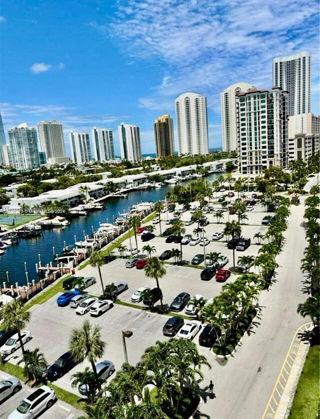 400 Kings Point Dr Unit 928, Sunny Isles Beach, FL 33160 - drone / aerial view of a view of skyline, a large body of water, and a marina