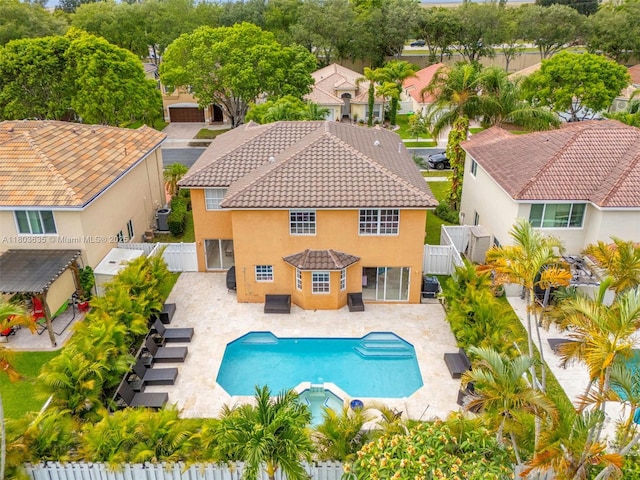2238 NW 139th Ave, Sunrise, FL 33323 - view of pool featuring a fenced backyard, a pool with connected hot tub, and a residential view