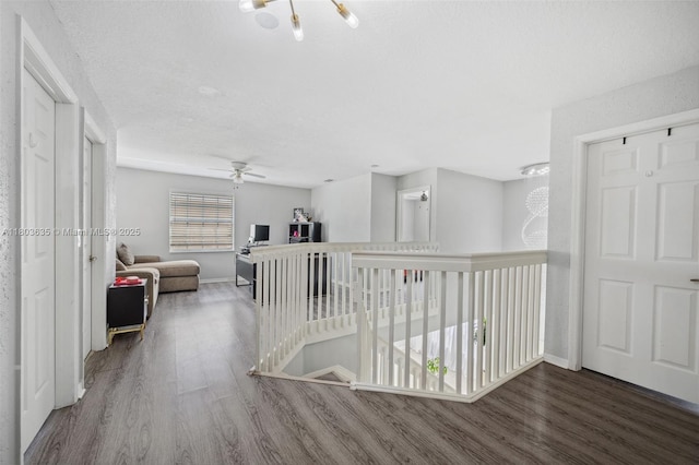 2238 NW 139th Ave, Sunrise, FL 33323 - hallway with wood finished floors, an upstairs landing, and baseboards