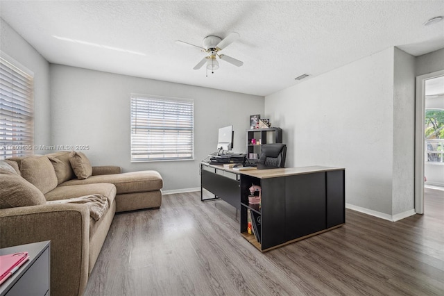 2238 NW 139th Ave, Sunrise, FL 33323 - office area with wood finished floors, ceiling fan, healthy amount of natural light, baseboards, and a textured ceiling