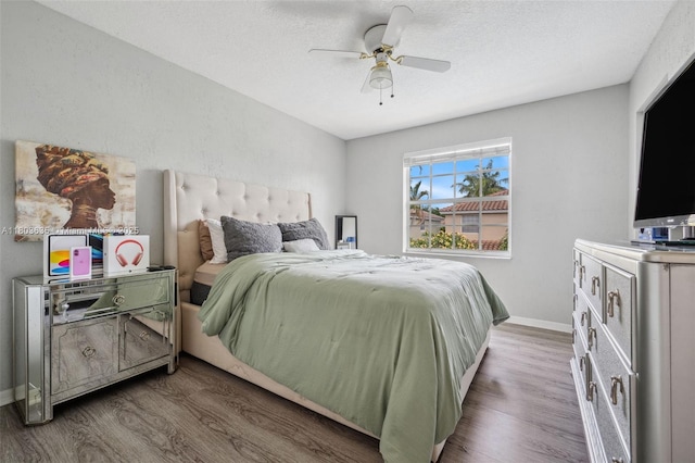 2238 NW 139th Ave, Sunrise, FL 33323 - bedroom with wood finished floors, baseboards, ceiling fan, and a textured ceiling