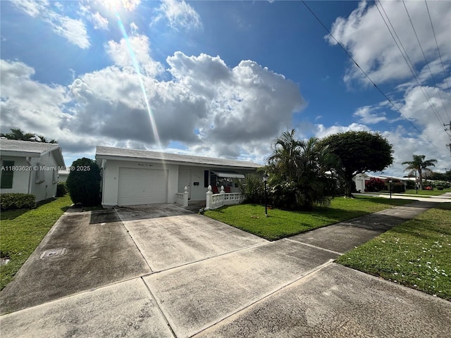single story home with a front yard, a garage, concrete driveway, stucco siding, and covered porch