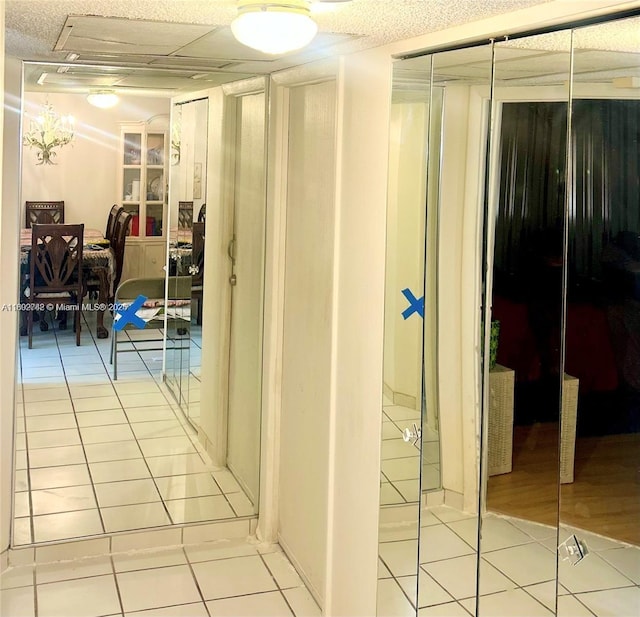 hallway with light tile patterned floors