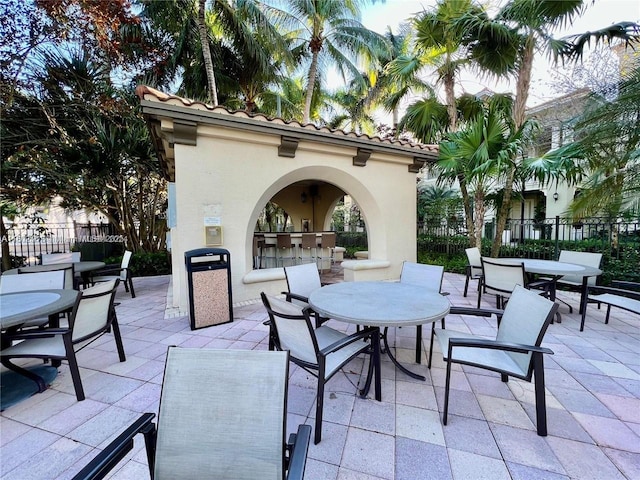 12490 NW 33rd St, Sunrise, FL 33323 - view of patio / terrace with outdoor dining space, fence, and area for grilling