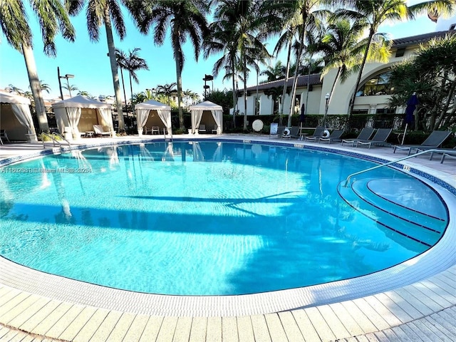 12490 NW 33rd St, Sunrise, FL 33323 - community pool featuring a gazebo, fence, and a patio