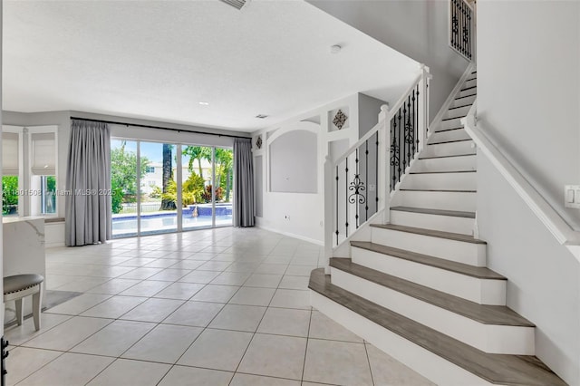 12339 NW 25th St, Coral Springs, FL 33065 - staircase featuring tile patterned floors