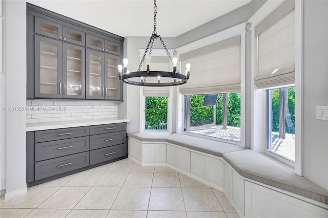 12339 NW 25th St, Coral Springs, FL 33065 - unfurnished dining area with a chandelier and light tile patterned floors