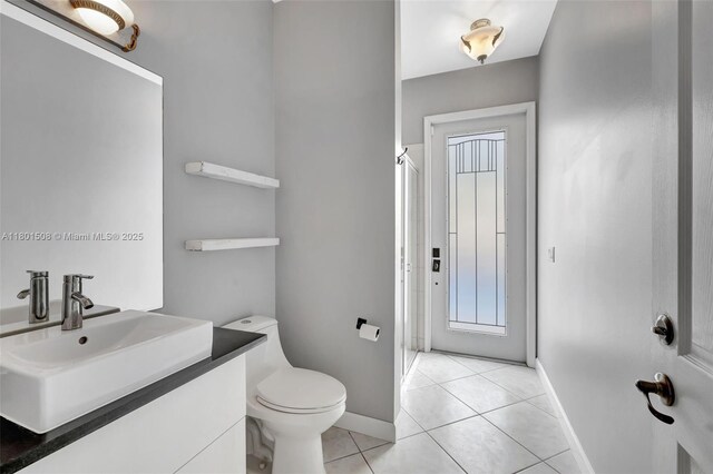 12339 NW 25th St, Coral Springs, FL 33065 - full bath featuring baseboards, tile patterned floors, a shower stall, and toilet