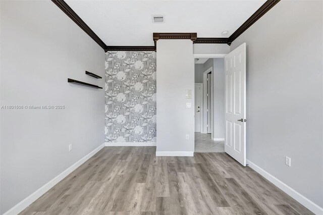 12339 NW 25th St, Coral Springs, FL 33065 - unfurnished room with ornamental molding, baseboards, and wood finished floors