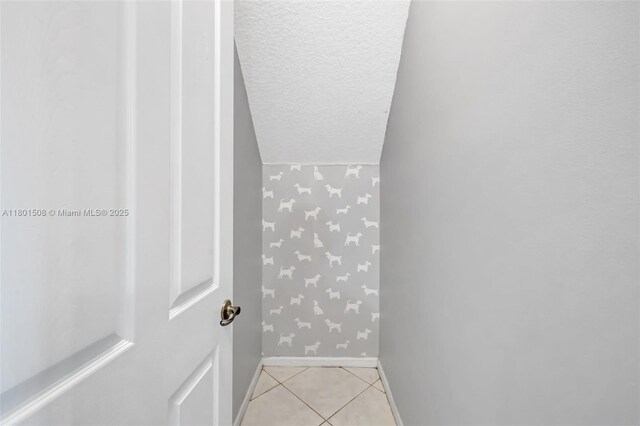12339 NW 25th St, Coral Springs, FL 33065 - bathroom featuring baseboards, wallpapered walls, tile patterned flooring, and a textured ceiling