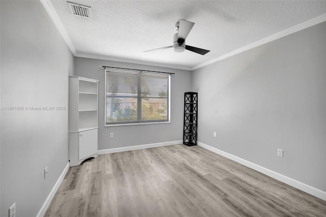 12339 NW 25th St, Coral Springs, FL 33065 - empty room featuring a textured ceiling, crown molding, a ceiling fan, wood finished floors, and baseboards