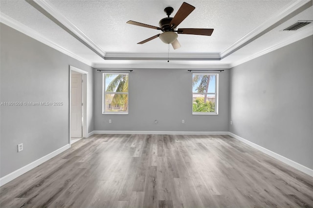 12339 NW 25th St, Coral Springs, FL 33065 - unfurnished room featuring a raised ceiling, a textured ceiling, wood finished floors, a ceiling fan, and ornamental molding