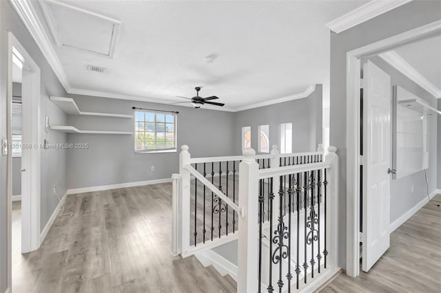 12339 NW 25th St, Coral Springs, FL 33065 - hall featuring an upstairs landing, wood finished floors, baseboards, crown molding, and attic access