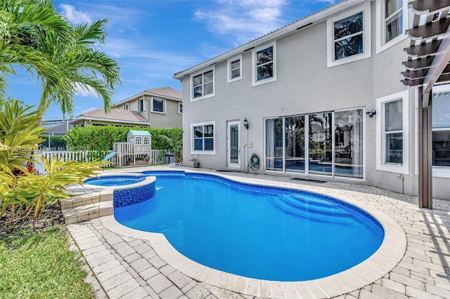 12339 NW 25th St, Coral Springs, FL 33065 - view of pool with fence, a pool with connected hot tub, a patio, and a playground