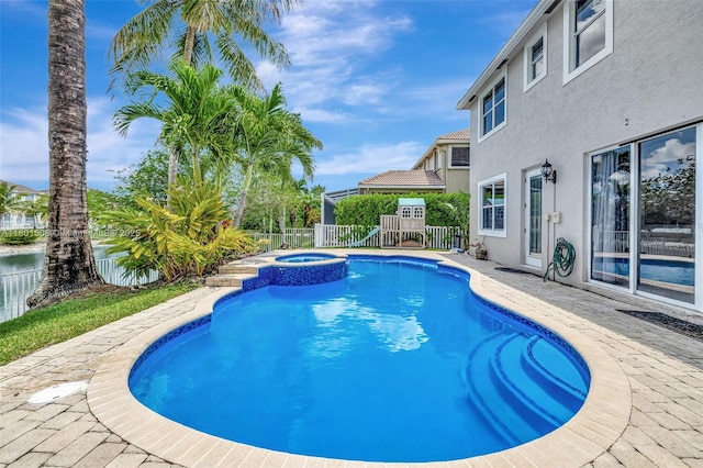 12339 NW 25th St, Coral Springs, FL 33065 - view of swimming pool with a fenced backyard and a pool with connected hot tub