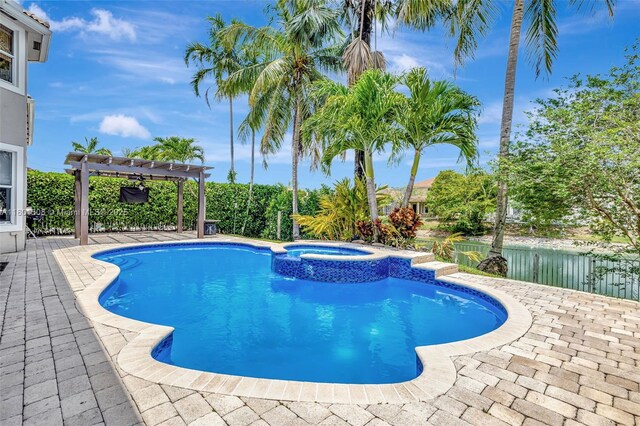 12339 NW 25th St, Coral Springs, FL 33065 - view of swimming pool featuring a pergola, a pool with connected hot tub, and a patio
