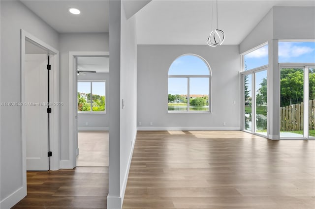 3835 Lombardy St, Hollywood, FL 33021 - unfurnished living room with wood finished floors, baseboards, and ceiling fan