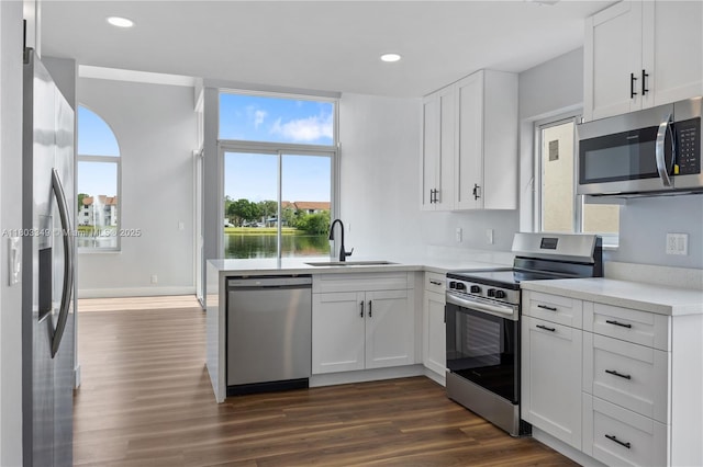3835 Lombardy St, Hollywood, FL 33021 - kitchen with stainless steel appliances, a sink, dark wood-type flooring, healthy amount of natural light, and recessed lighting