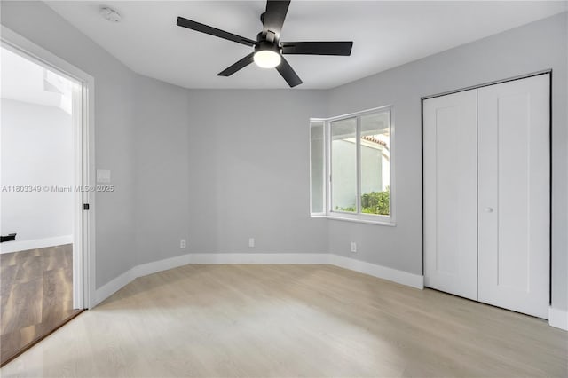 3835 Lombardy St, Hollywood, FL 33021 - unfurnished bedroom with light wood-type flooring, baseboards, and ceiling fan