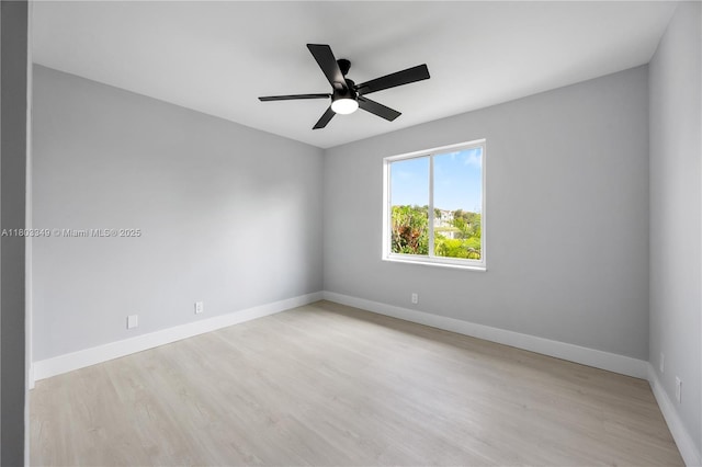 3835 Lombardy St, Hollywood, FL 33021 - empty room with wood finished floors, ceiling fan, and baseboards