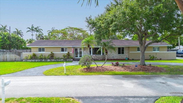 9750 SW 143rd Dr, Miami, FL 33176 - ranch-style home featuring french doors and stucco siding