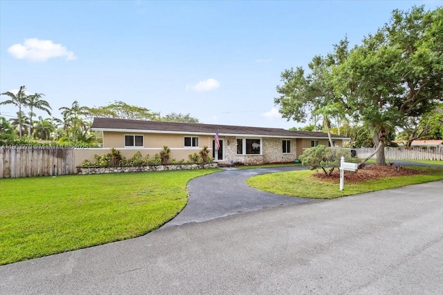 9750 SW 143rd Dr, Miami, FL 33176 - ranch-style house with driveway, stucco siding, and stone siding