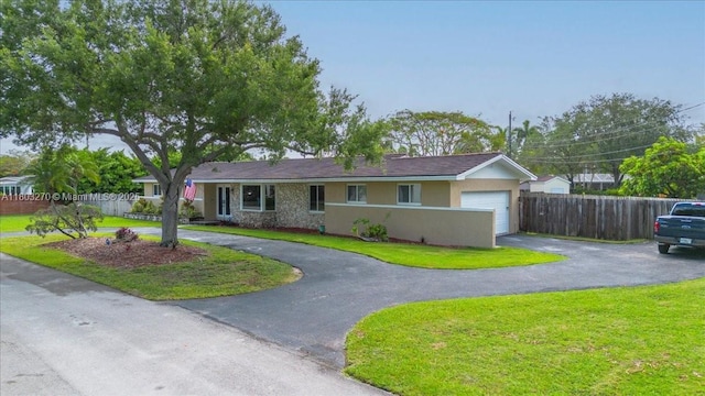 9750 SW 143rd Dr, Miami, FL 33176 - ranch-style home featuring driveway, stucco siding, and an attached garage