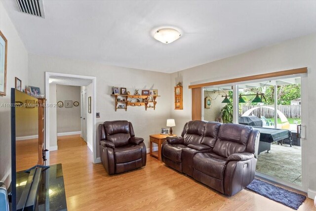 9750 SW 143rd Dr, Miami, FL 33176 - living area with light wood-style flooring and baseboards