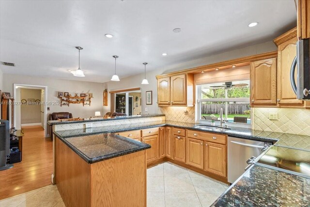 9750 SW 143rd Dr, Miami, FL 33176 - kitchen featuring stainless steel appliances, open floor plan, light tile patterned flooring, tasteful backsplash, and decorative light fixtures