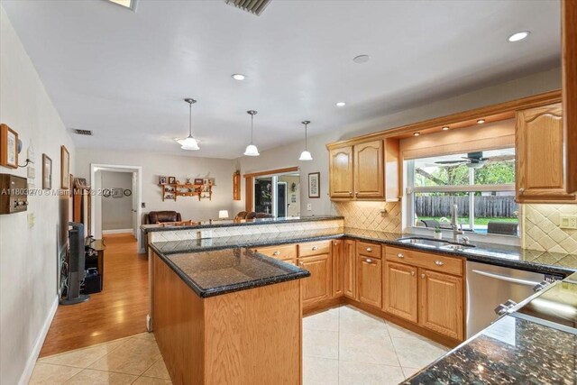9750 SW 143rd Dr, Miami, FL 33176 - kitchen with a sink, stainless steel dishwasher, tasteful backsplash, a peninsula, and decorative light fixtures