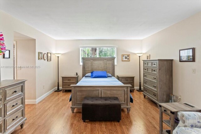 9750 SW 143rd Dr, Miami, FL 33176 - bedroom featuring light wood-style flooring and baseboards