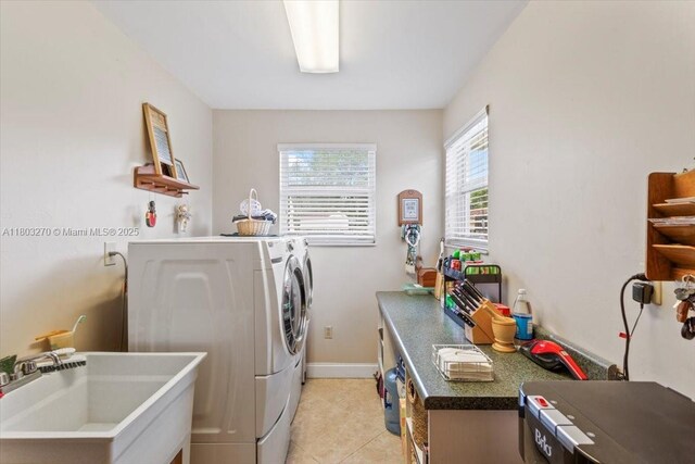 9750 SW 143rd Dr, Miami, FL 33176 - washroom featuring independent washer and dryer, light tile patterned flooring, and baseboards