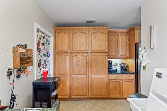 9750 SW 143rd Dr, Miami, FL 33176 - kitchen featuring freestanding refrigerator, light tile patterned flooring, and brown cabinets
