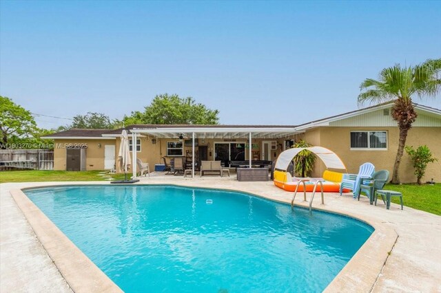 9750 SW 143rd Dr, Miami, FL 33176 - view of pool featuring a patio area, an outdoor living space, and fence