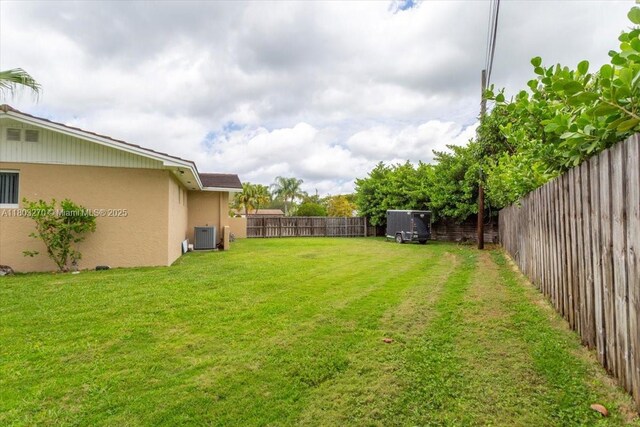 9750 SW 143rd Dr, Miami, FL 33176 - view of yard featuring central AC unit