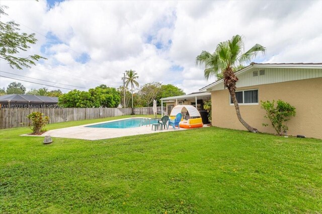 9750 SW 143rd Dr, Miami, FL 33176 - view of swimming pool featuring a patio area