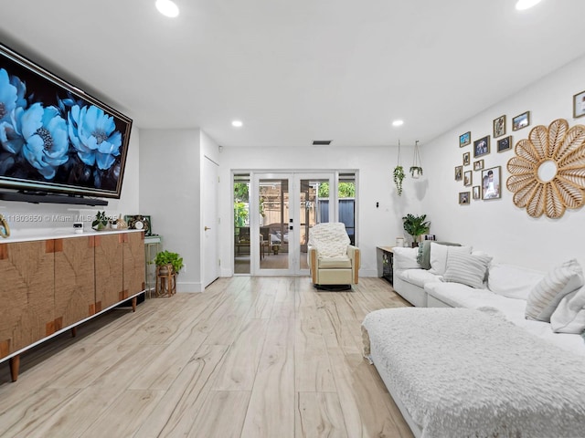 7165 W 13th Ave, Hialeah, FL 33014 - living area with french doors, recessed lighting, and light wood-style flooring