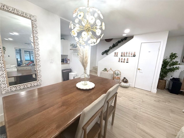 dining space featuring a chandelier, recessed lighting, and wood finished floors