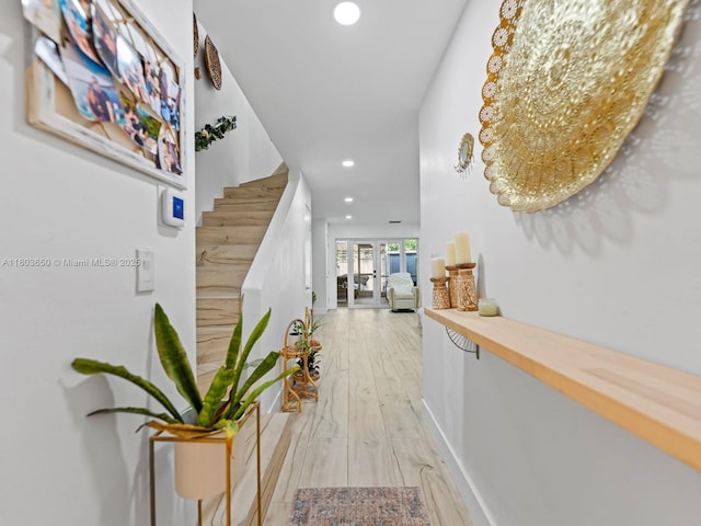 7165 W 13th Ave, Hialeah, FL 33014 - corridor featuring recessed lighting, light wood finished floors, stairway, french doors, and baseboards