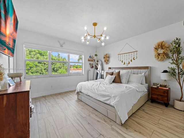 7165 W 13th Ave, Hialeah, FL 33014 - bedroom with a chandelier, baseboards, and light wood-style flooring