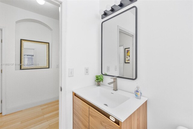2350 SE 19th Ct Unit 0, Homestead, FL 33035 - bathroom with wood finished floors, vanity, and baseboards