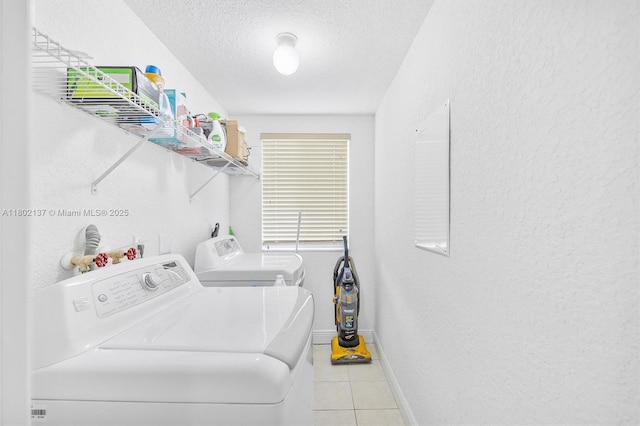 2350 SE 19th Ct Unit 0, Homestead, FL 33035 - laundry area featuring independent washer and dryer, baseboards, a textured ceiling, a textured wall, and light tile patterned floors