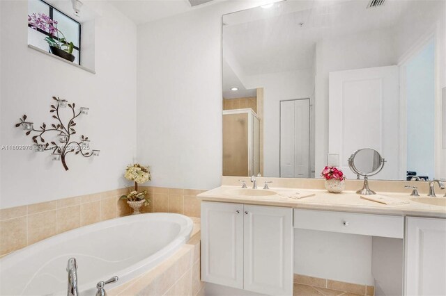 2901 NW 126th Ave Unit 2-415, Sunrise, FL 33323 - bathroom featuring a bath, a shower stall, double vanity, and tile patterned flooring