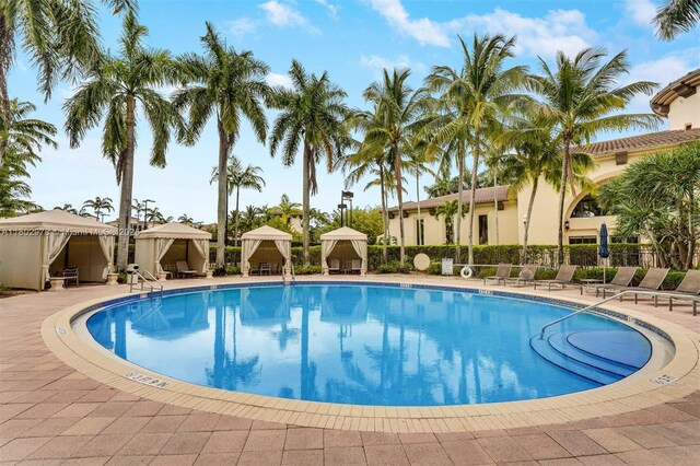 2901 NW 126th Ave Unit 2-415, Sunrise, FL 33323 - community pool featuring a gazebo, fence, and a patio