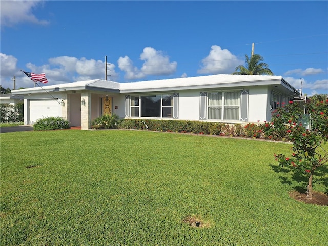 1101 SW 75th Ter, Plantation, FL 33317 - ranch-style home featuring an attached garage, a front lawn, stucco siding, and asphalt driveway