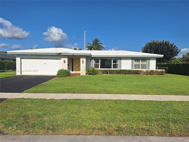 1101 SW 75th Ter, Plantation, FL 33317 - single story home featuring an attached garage, a front yard, asphalt driveway, and stucco siding