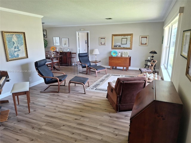 1101 SW 75th Ter, Plantation, FL 33317 - living room featuring light wood-style flooring, crown molding, a textured ceiling, and baseboards