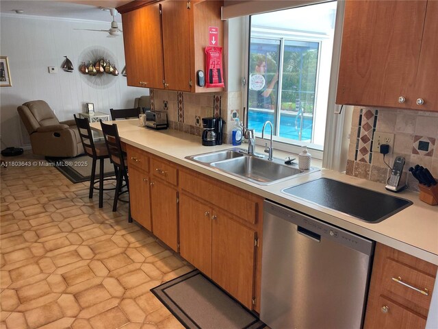 1101 SW 75th Ter, Plantation, FL 33317 - kitchen with dishwasher, light countertops, tasteful backsplash, a ceiling fan, and brown cabinets